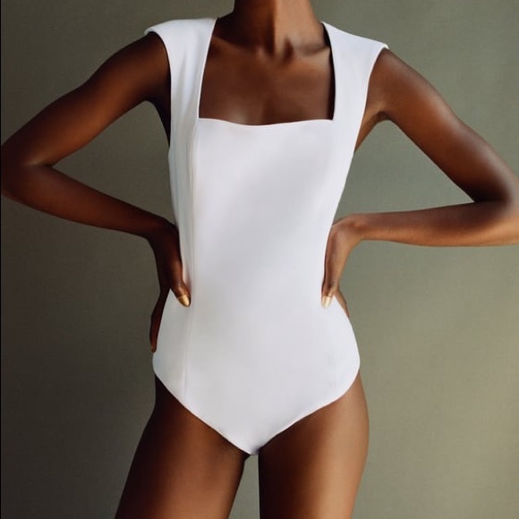 Zara Tops - NWOT Zara white body suit with shoulder pads!